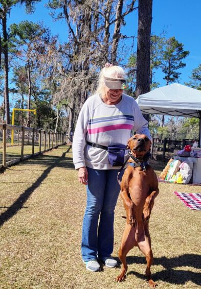 Dog hanging out with mom at Backyard Dog Racing League