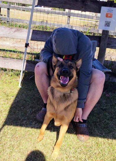 Smiling dog with owner after racing