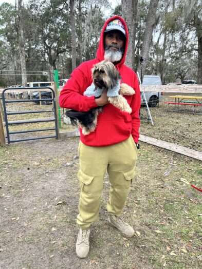 dog park with a man and a dog.