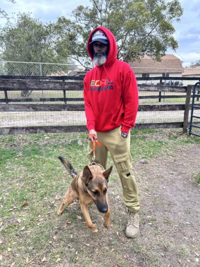 dog park with a man and a dog.