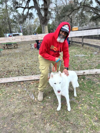 dog park with a man and a dog.